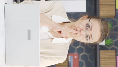 Vertical-video-of-Business-woman-looking-at-camera-angry-and-aggressive.